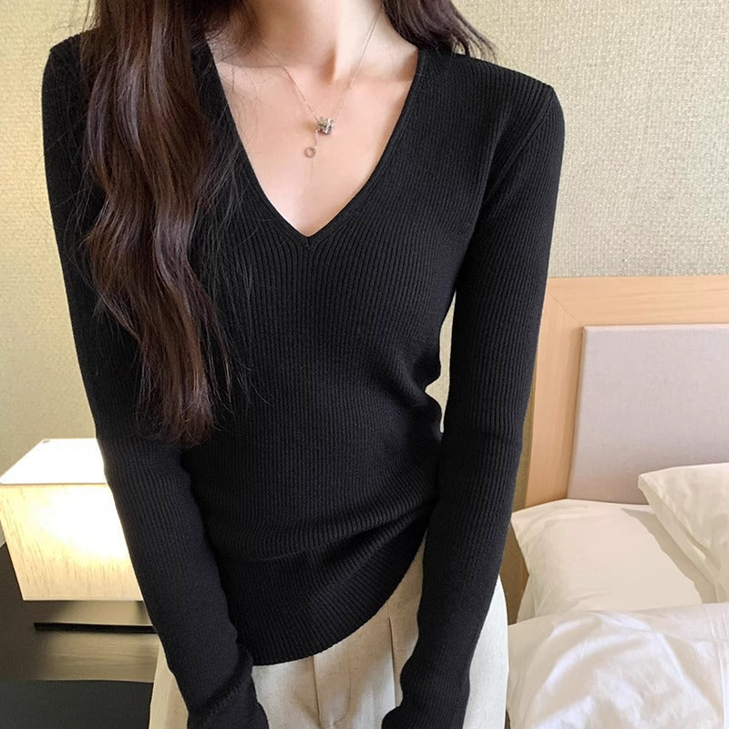 Slimming Knit Top With A Distinctive V-neck And Long Sleeves