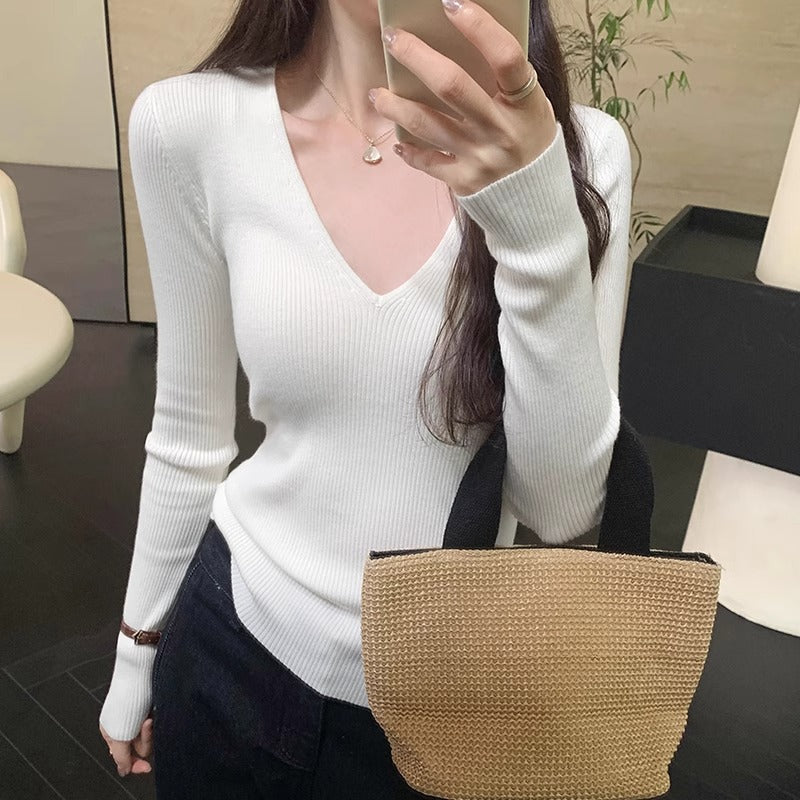 Slimming Knit Top With A Distinctive V-neck And Long Sleeves